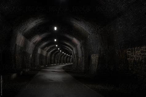 View Into A Dark Old Railway Tunnel Stretching Into The Distance By