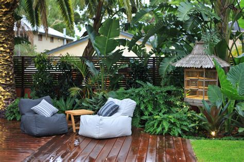This vinyl fence in a texas backyard is softened by a meandering bed filled with. bali in burraneer - Asian - Landscape - other metro - by ...