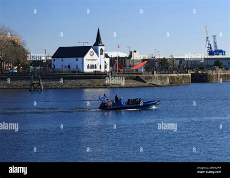 Norwegian Church And Speed Boat Cardiff Bay South Wales Stock Photo