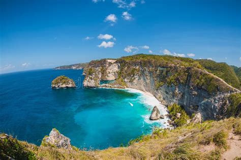 Amazing Cliff Beach And Blue Ocean With Waves In Bali Stock Photo