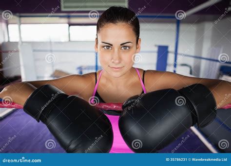 Close Up Of A Beautiful Woman In Black Boxing Gloves Stock Image