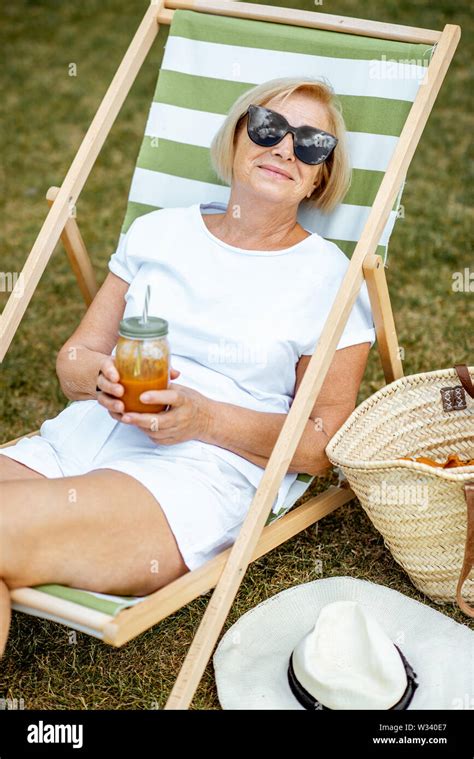 Carefree Mature Woman Sunbathing Hi Res Stock Photography And Images