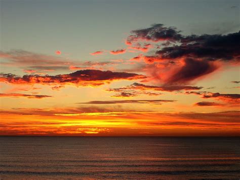 Hd Wallpaper Body Of Water During Golden Hours Sunrise Sunset Cloud