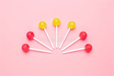 Pink And Yellow Candy On A Pastel Pink Background Stock Photo Image