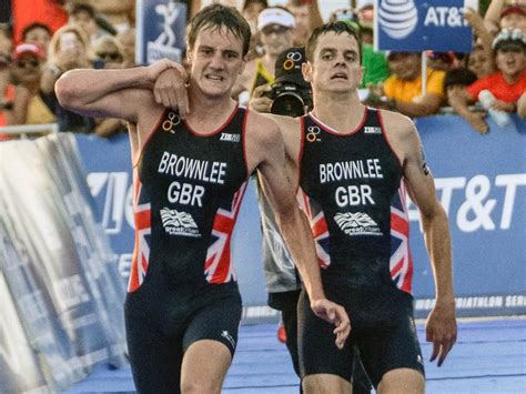 Jonny brownlee helped over line by brother alistair. Jonny Brownlee carried over finish line by brother ...