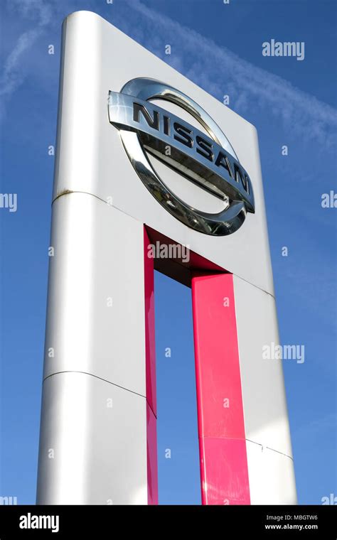 Nissan Dealership Sign Against Blue Sky Nissan Is The Worlds Largest