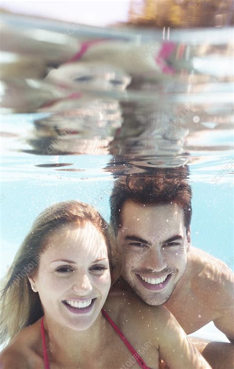Couple Smiling In Swimming Pool Stock Image F0139590 Science Photo Library