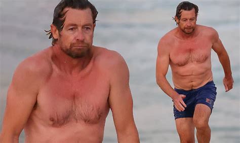 Shirtless Simon Baker Looks Freezing As He Goes For A Swim And