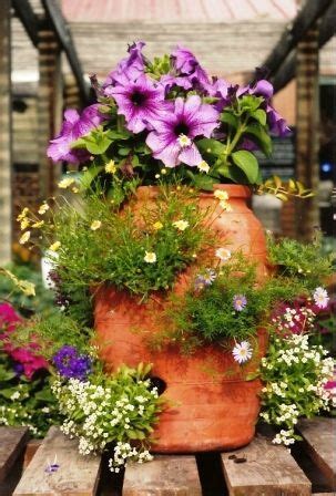 When you plant a terracotta strawberry pot you do it with high hopes. Use this idea to plant strawberries Planter Fountain ...