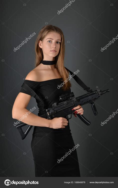 Beautiful Woman With Gun Stock Photo By ©muro 168648878