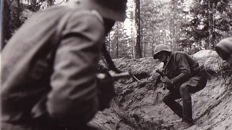 Online Crop Soldier Holding Gun Near Tree Military World War Ii
