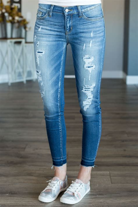 Light Washed Distressed And Slightly Cropped Skinny Jeans By Judy Blue