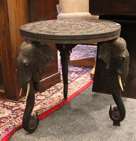 A Profusely Carved Indian Hardwood Elephant Table With Three Elephant