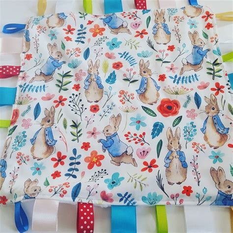 White Peter Rabbit Taggy Blanket With Soft White Dimpled Fleece Back