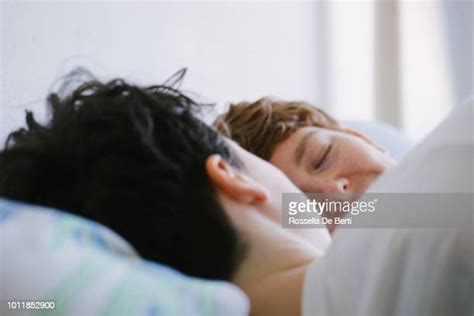 gay couple sleeping in bed photos and premium high res pictures getty images