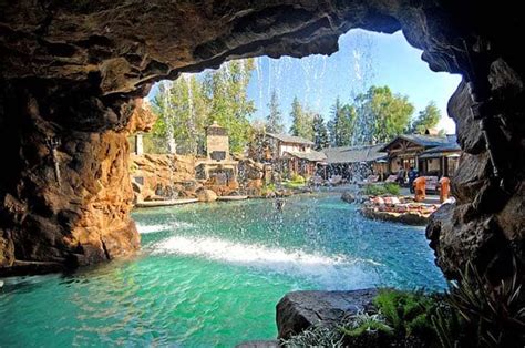 A Luxurious Pool With A Waterfall And A Cave At Old Lion