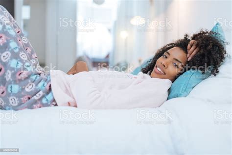 Happy Beautiful Young Black Woman Relaxed Lying Down In The Bed N Stock