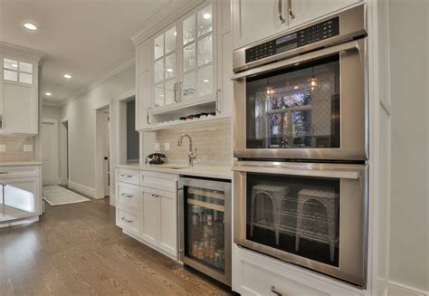 Double Wall Ovens A Beverage Fridge And Glass Cabinetry With Gorgeous