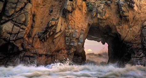 Waves And Sea Spray Through A Sea Arch At Pfeiffer Beach In Big Sur