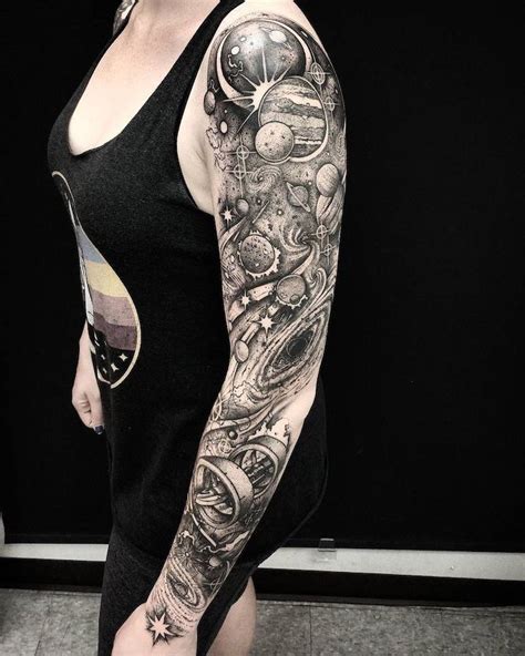 Galaxy Tattoo Sleeve On Woman Wearing Black Top And Pants Black And