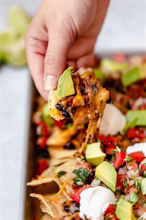 NACHOS Layered With A Crisp Tortilla Chips A Simple Seasoned Ground