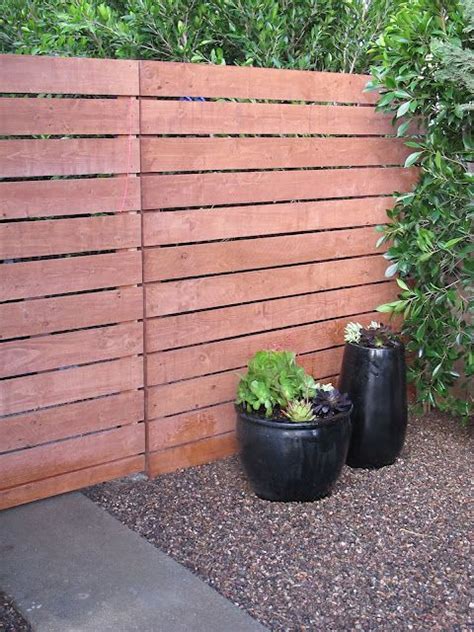 Backyards fences and walls landscaping and hardscaping outdoor rooms. using precut home depot fence panels to make a modern ...
