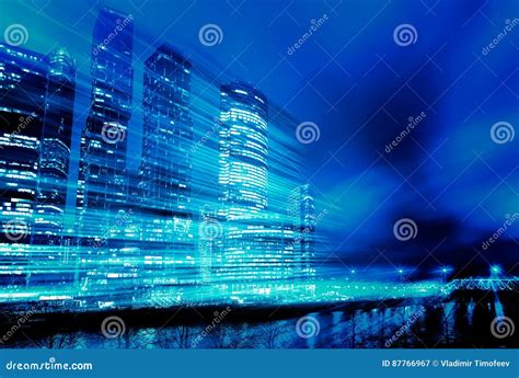 Light Trails On Modern Building Background Concept Of Skyscrapers In