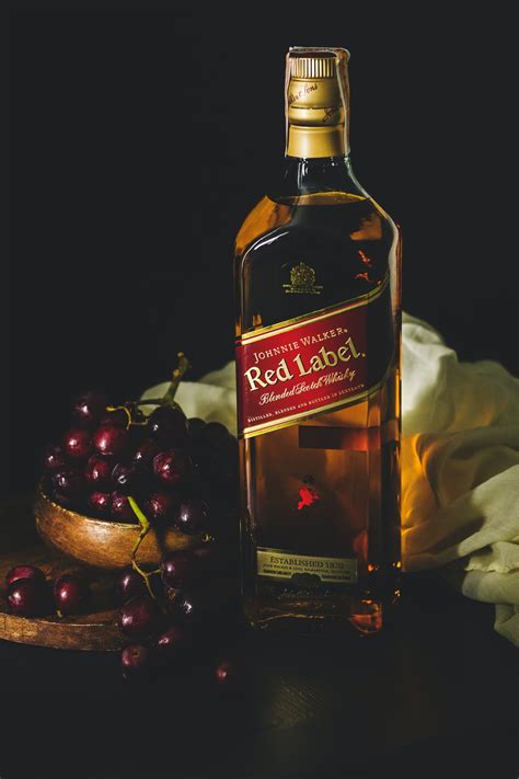 Download wallpaper 1920x1080 alan walker, dj, music, hd images, backgrounds, photos and pictures for desktop,pc,android,iphones. Johnnie Walker red label bottle beside bowl of red grapes ...