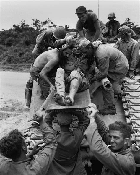 Wounded Marine Is Removed From A Tank Photograph By Everett Pixels