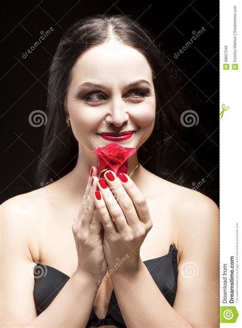 portrait of and sensual brunette woman posing with red flower stock image image of facial
