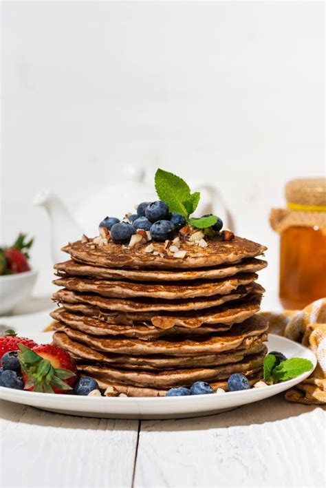 Stack Of Homemade Delicious Pancakes For Breakfast On White Table