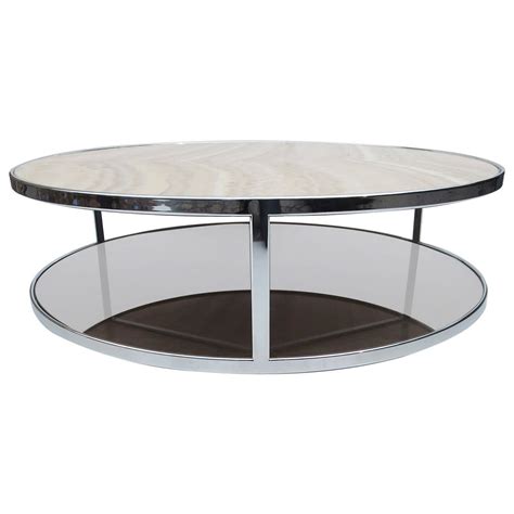 The benson coffee table measures 120×95 cm and is composed of an elliptical base and a raised circular top. Onyx and Bronzed Glass Coffee Table by Rodolfo Dordoni for ...
