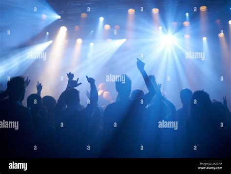 Cheering On Their Favourite Band Shot Of Adoring Fans At A Rock