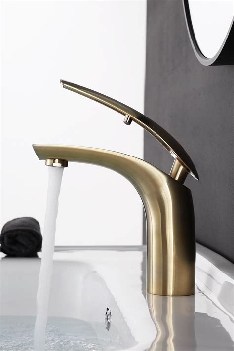 A mix of natural stone and industrial metals comes together to create a unique guest bathroom design that's a real showpiece in the home. Bathroom sink short faucet, deck mounted basin faucet taps ...