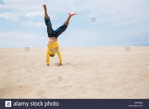 Boy Doing Handstand On Beach Stock Photo Alamy