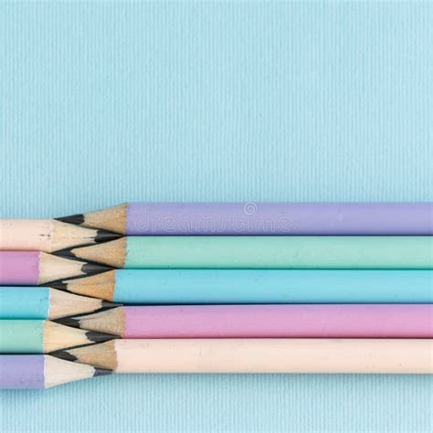 Pastel Colored Pencils On Empty Sheet Blue Toned Stock Image Image