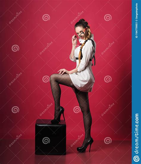 Brunette Girl Posing At The Red Background Stock Image Image Of Modern Beautiful 194778951