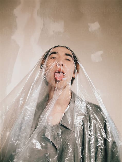 Young Man Covered With Plastic Bag Del Colaborador De Stocksy Sergey