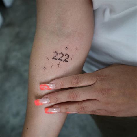 222 Lettering Tattoo Located On The Inner Forearm
