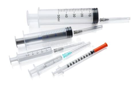 Different Disposable Syringes With Needles On White Background Stock