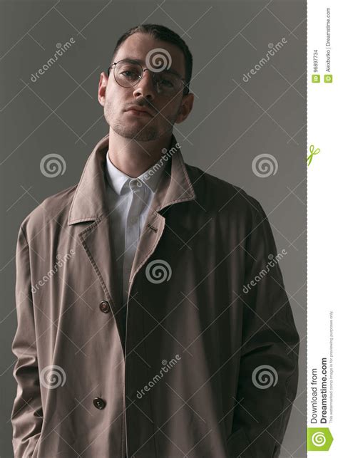 A Lonely Handsome Guy In A Raincoat And Glasses With Different Moods