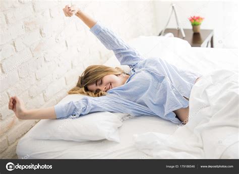 Optimistic Girl Waking Up And Stretching — Stock Photo © Tonodiaz
