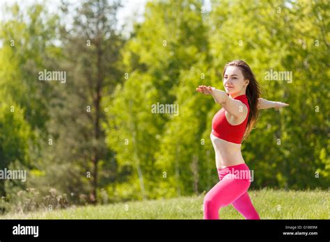 Young Slim Woman Practicing Yoga Warrior Pose Athletic Girl Doing Yoga