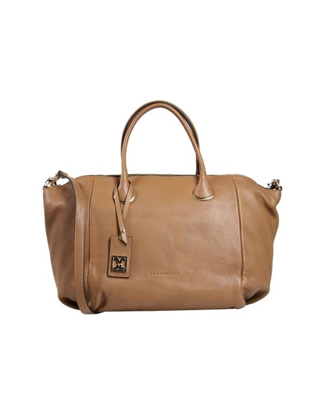 Shop coccinelle bags, handbags and purses online now at wardow.com! Coccinelle Large Leather Bag in Brown (Camel) | Lyst
