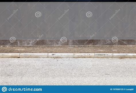 Gray Painted Wall With A Strip Of Natural Stone Tiles Porphyry