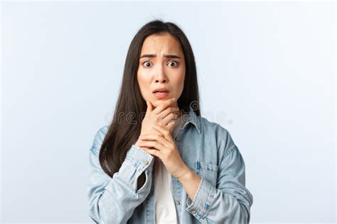 lifestyle people emotions and beauty concept shocked scared and concerned asian girl feeling