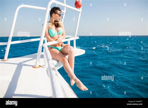 Girl In A Bikini Rest On A Yacht In The Middle Of The Ocean Beautiful