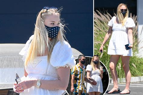 Pregnant Sophie Turner Shows Off Growing Baby Bump In Short Dress While