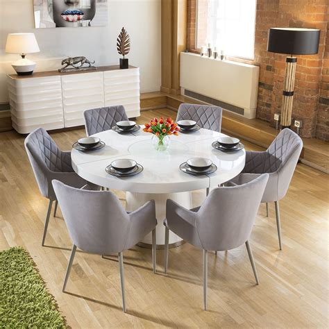 This set features a round dining table and four dining chairs. Round Dining Table Set For 6 ...
