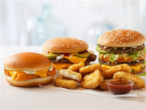 Jeff baughman bites into his double cheeseburger with a super fries and a super coke on july 18, 2002 at a mcdonalds in miami beach, florida. #McDonalds: Fast Food Chain Refutes "Quarter Pounder" Non ...